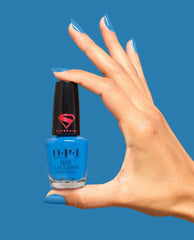 Up Up and Ablaze Bold Blue Nail Polish Hand and Bottle