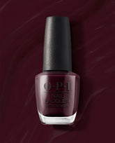 OPI nail polish bottle of “Yes, My Condor Can-do!” nail lacquer standing upright, showing a deep plum-wine shade with a black textured cap against a matching burgundy background for a bold, elegant manicure look.