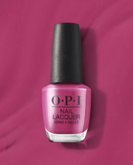 7th & Flower OPI nail polish bottle standing upright, showcasing rich magenta pink nail lacquer with a black cap against a matching glossy pink background, highlighting the vibrant salon-quality nail color for manicures and pedicures.