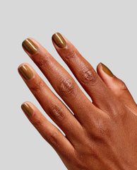 Hand displays glossy short nails painted with OPI Fast Foodie RapiDry, a warm shimmer brown shade from fall nail colors, against a light gray background.