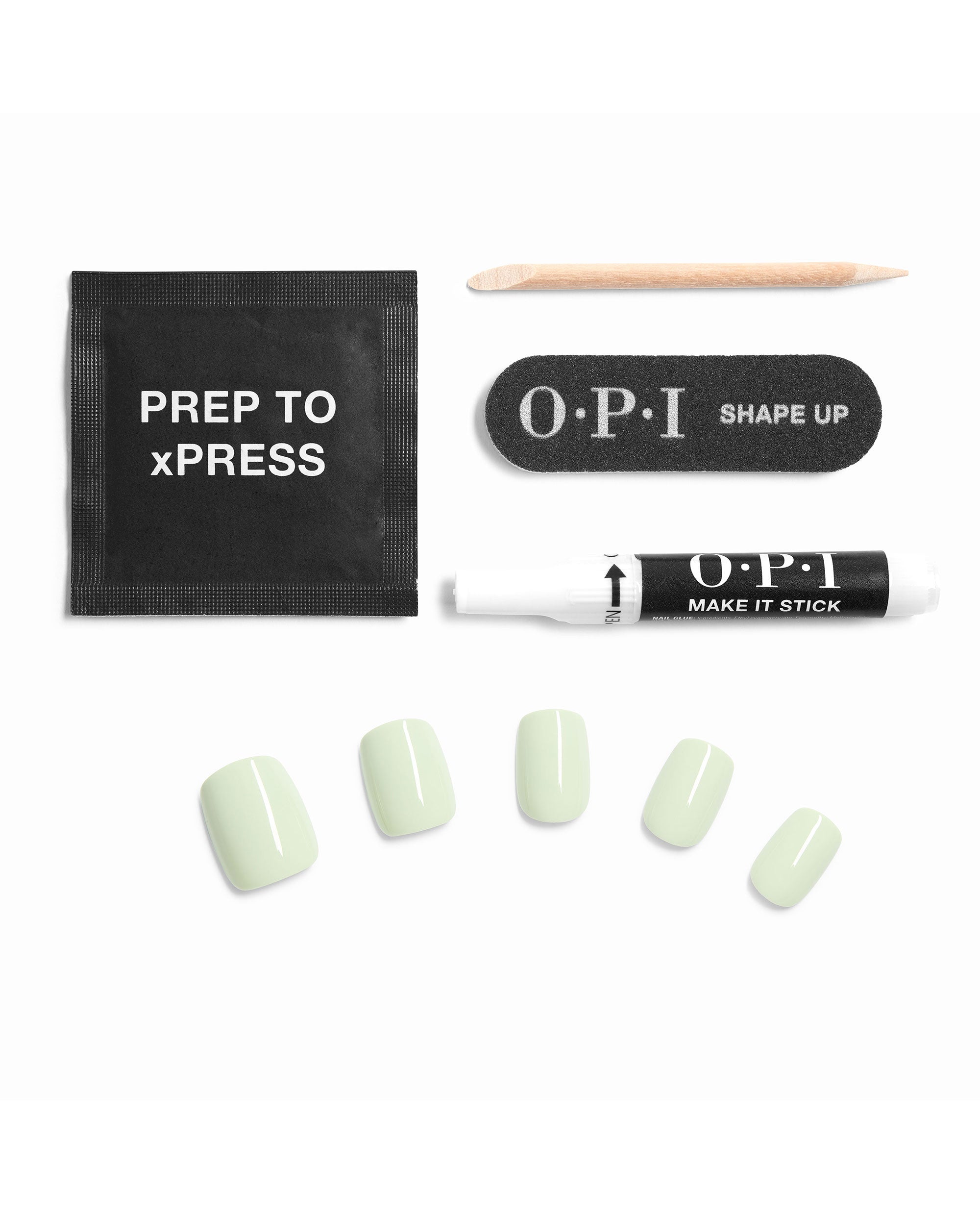 OPI On Point The Pass is Always Greener artificial nails kit contents arranged on white, with pale green press-on nails, prep pad, nail file, cuticle stick, and Make It Stick glue.