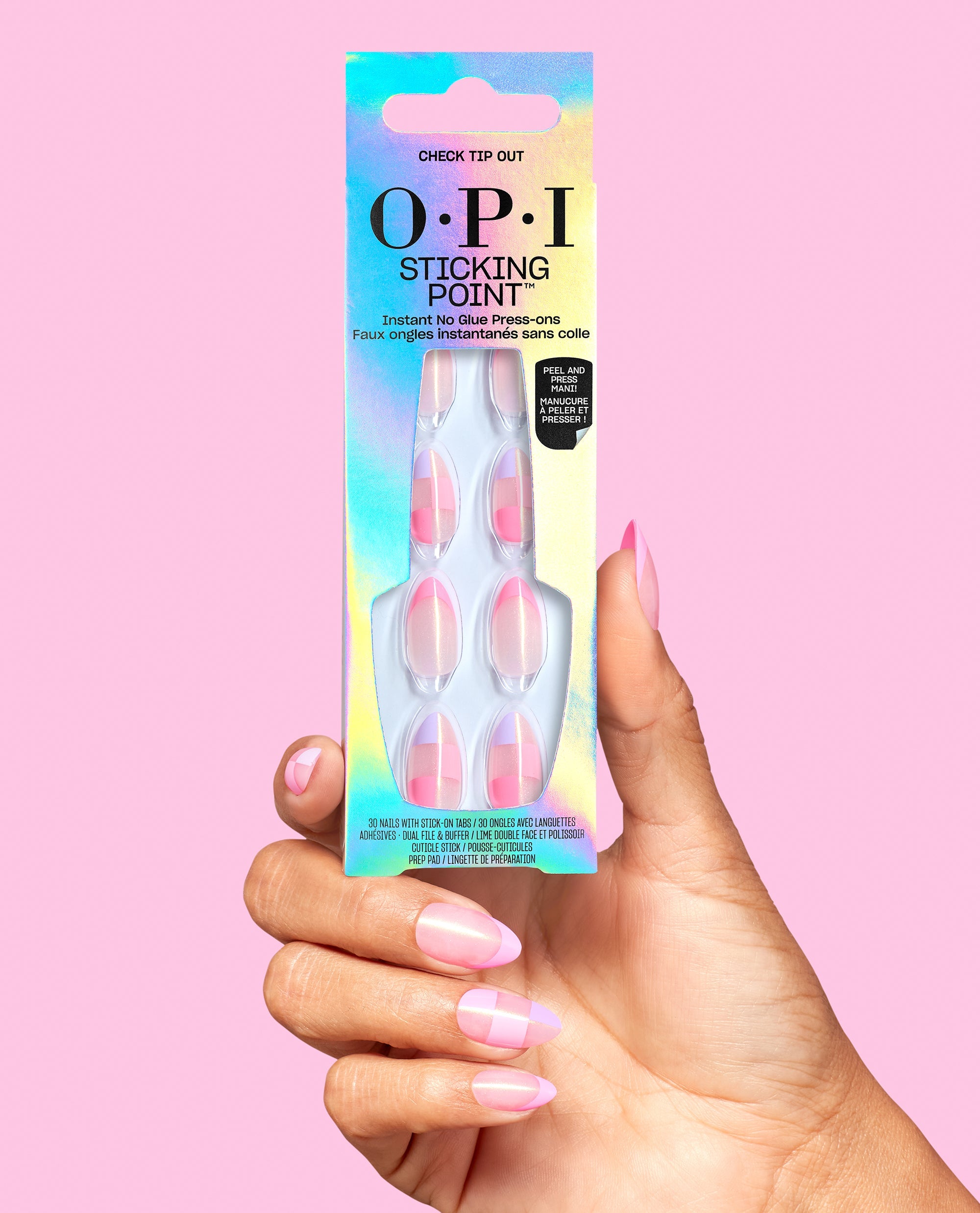 Hand holding OPI Sticking Point Check Tip Out instant no-glue press-on nails in iridescent packaging, showing pink checkered almond nails against a pink background.
