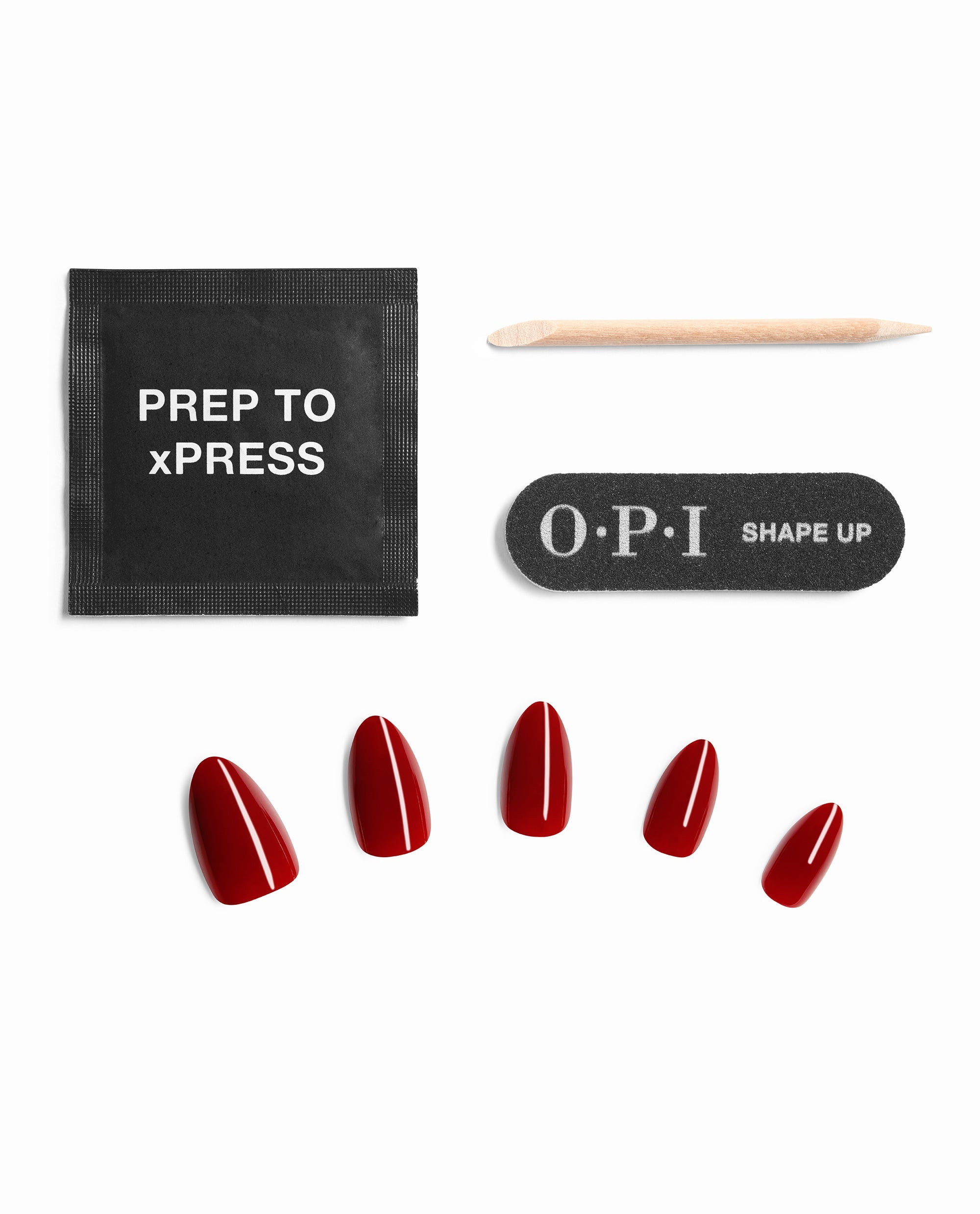 OPI Color So Hot it Berns Sticking Point kit displays glossy red press-on nails with a Prep to xPRESS pad, wood cuticle stick, and black Shape Up nail file on a white background.