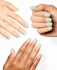 Hands display a glossy pale sage green OPI manicure in The Pass is Always Greener On Point shade on short rounded-square nails against a clean white background.