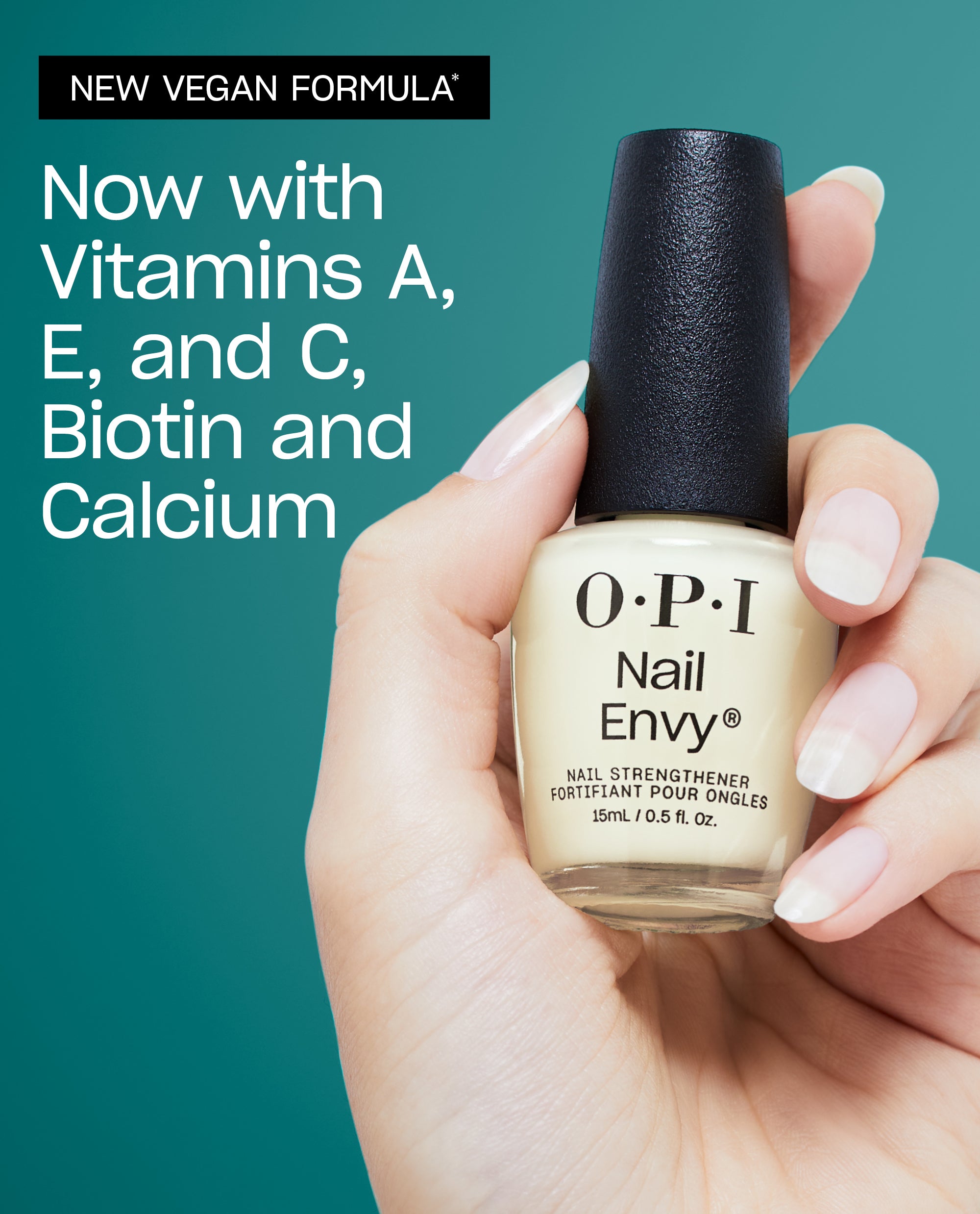 Hand holding OPI Nail Envy Nail Strengthener bottle against teal background, highlighting new vegan formula with vitamins A, E, C, biotin, and calcium, ideal as a nail polish gift set treatment for stronger, healthier nails.