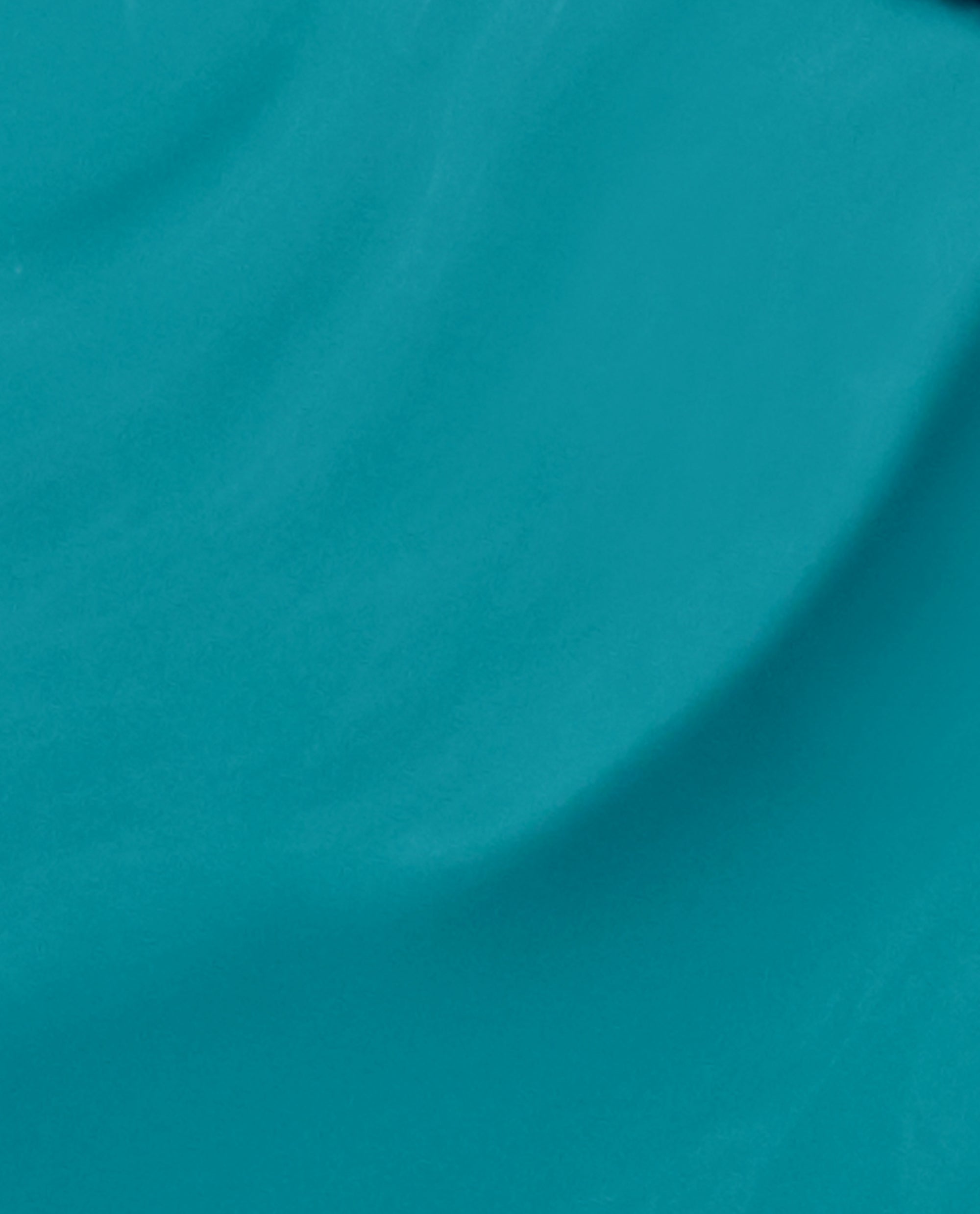 AmazON...AmazOFF Nail Lacquer by OPI sweeping in a close-up brush swatch, revealing rich teal green nail polish with a creamy, glossy finish—an eye-catching pick for spring nail colors.