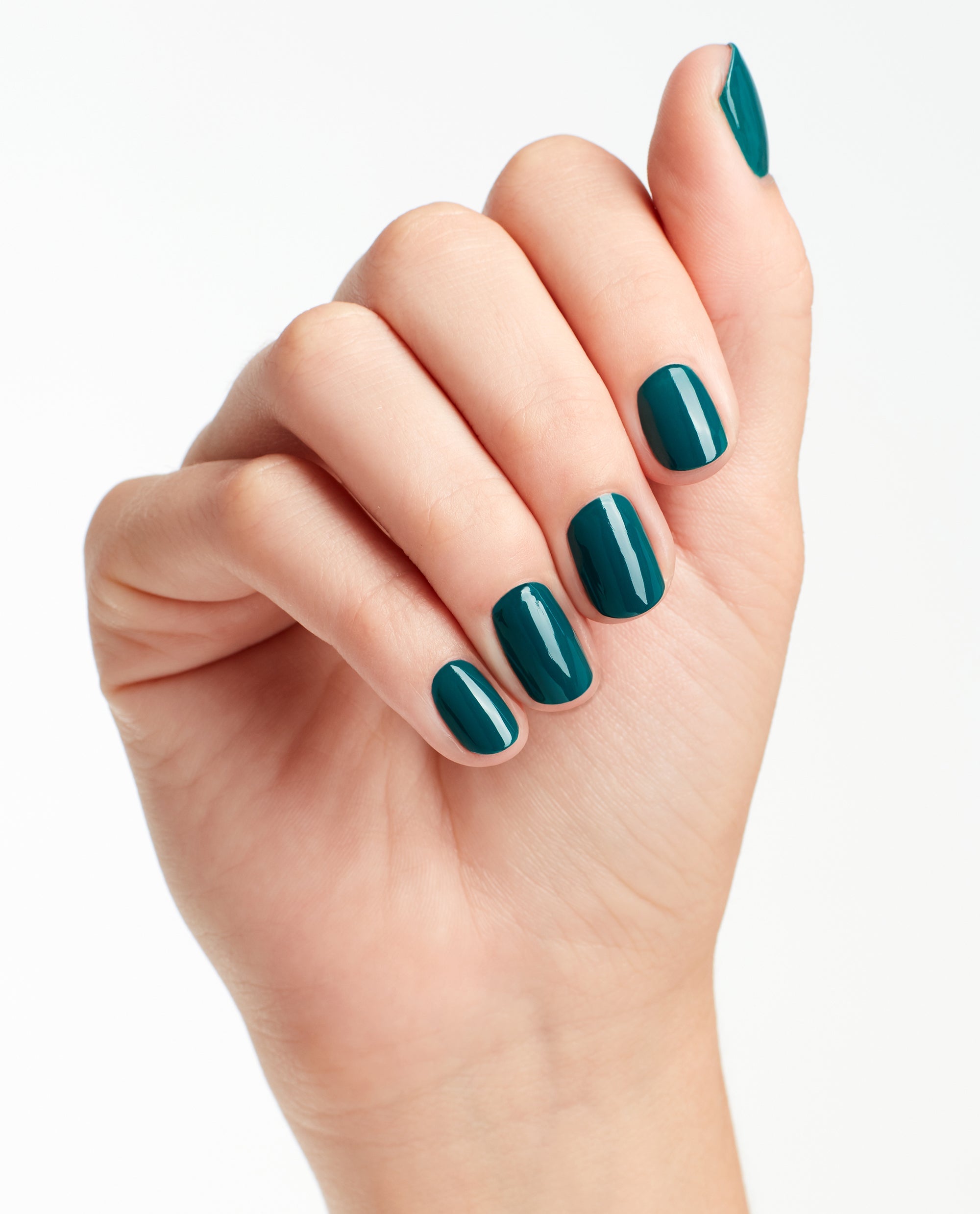 Manicured hand shows glossy teal nails painted with OPI AmazON...AmazOFF Nail Lacquer, a deep green nail polish perfect for spring nail colors, set against a clean white background.