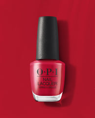 OPI nail polish bottle in the shade Art Walk in Suzi's Shoes, a vibrant classic red nail lacquer with a black textured cap, standing upright against a matching glossy red background for a bold manicure look.