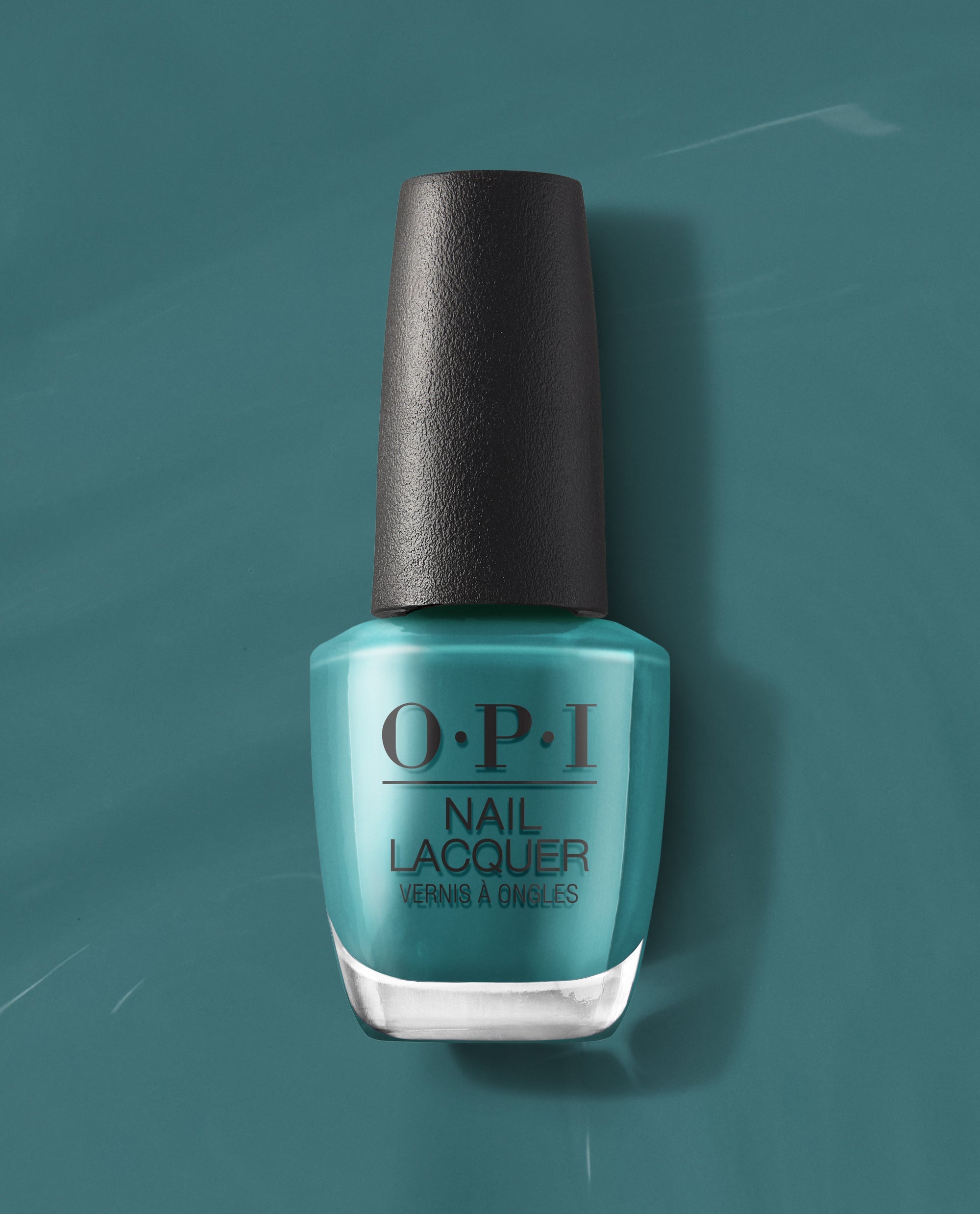 Baby Tee-l OPI nail polish bottle standing upright, showcasing a glossy teal nail lacquer shade against a matching teal background, highlighting the classic OPI Nail Lacquer packaging for US beauty shoppers.