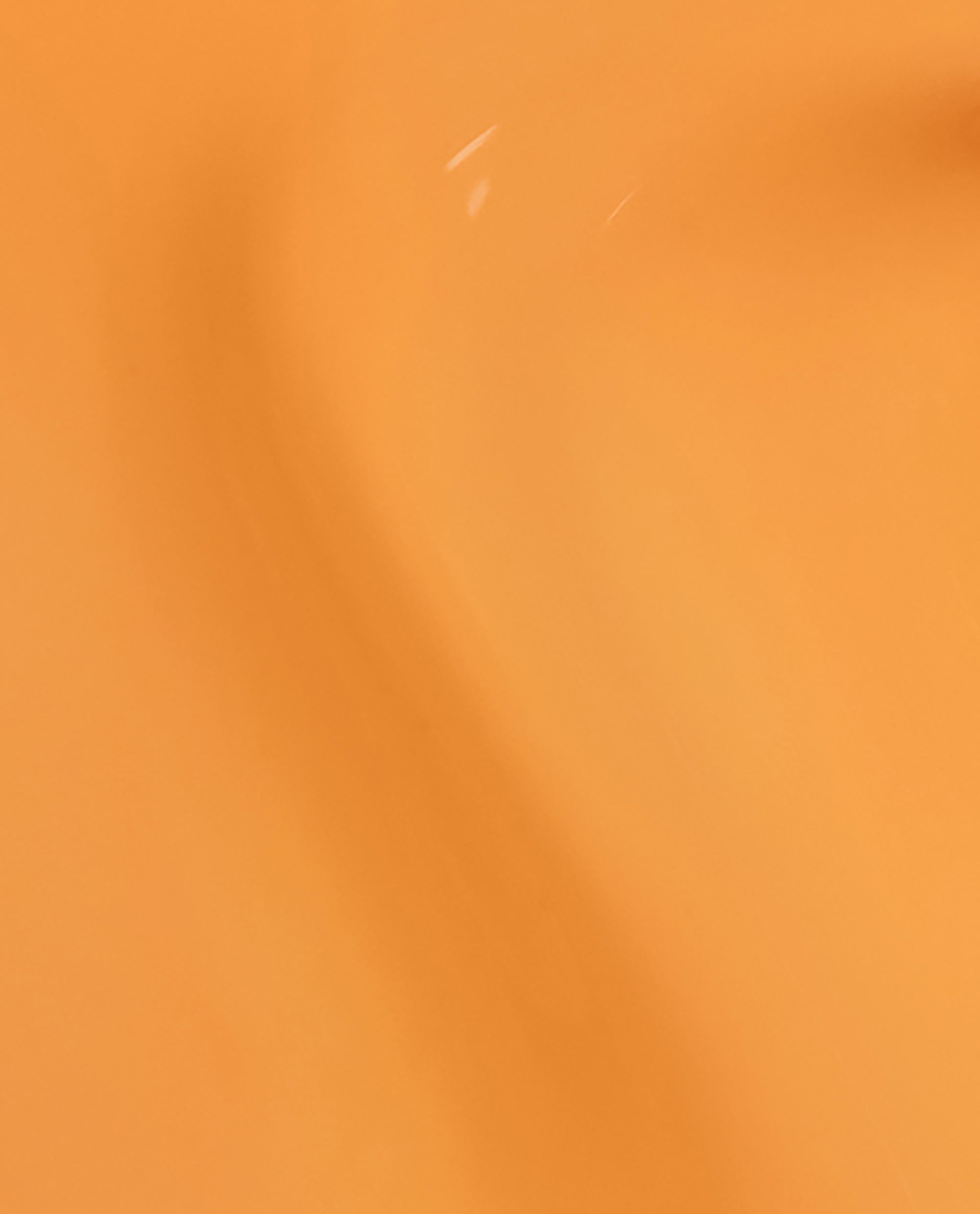 OPI Nature Strong Vegan Nail Lacquer Bee the Change spreads in a smooth, glossy marigold-honey crème brush swatch across a full-bleed background, spotlighting a cheerful shade for spring nail colors and spring nail trends.