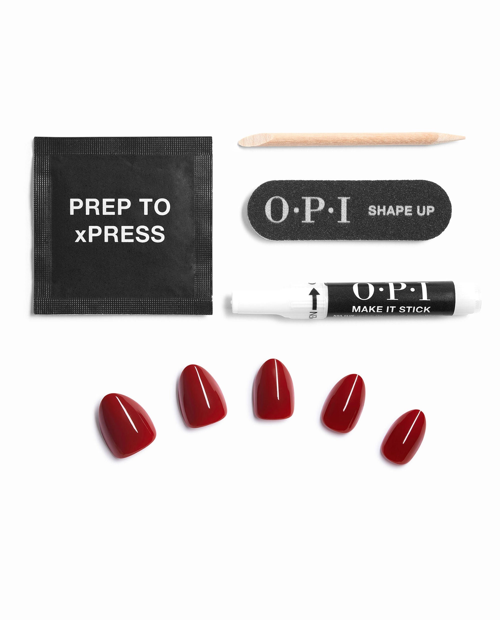 OPI Big Apple Red xPRESS/ON press-on nail kit displays glossy red artificial nails with Prep to xPress wipe, nail glue, file, and wooden cuticle stick on a white background, ideal for fall nail colors.