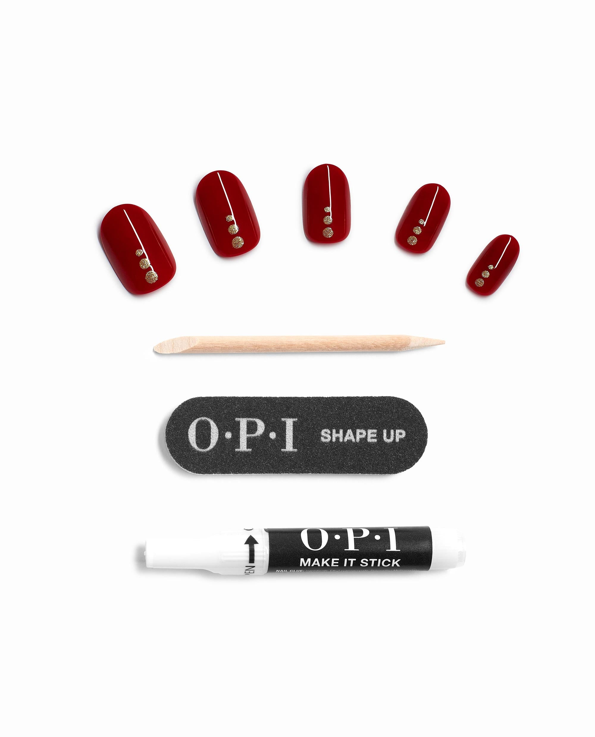 OPI Big Candy Apple Red On Point press-on nails display glossy deep red artificial nails with gold dot accents, plus cuticle stick, Shape Up nail file, and Make It Stick glue, a bold pick for fall nail colors.