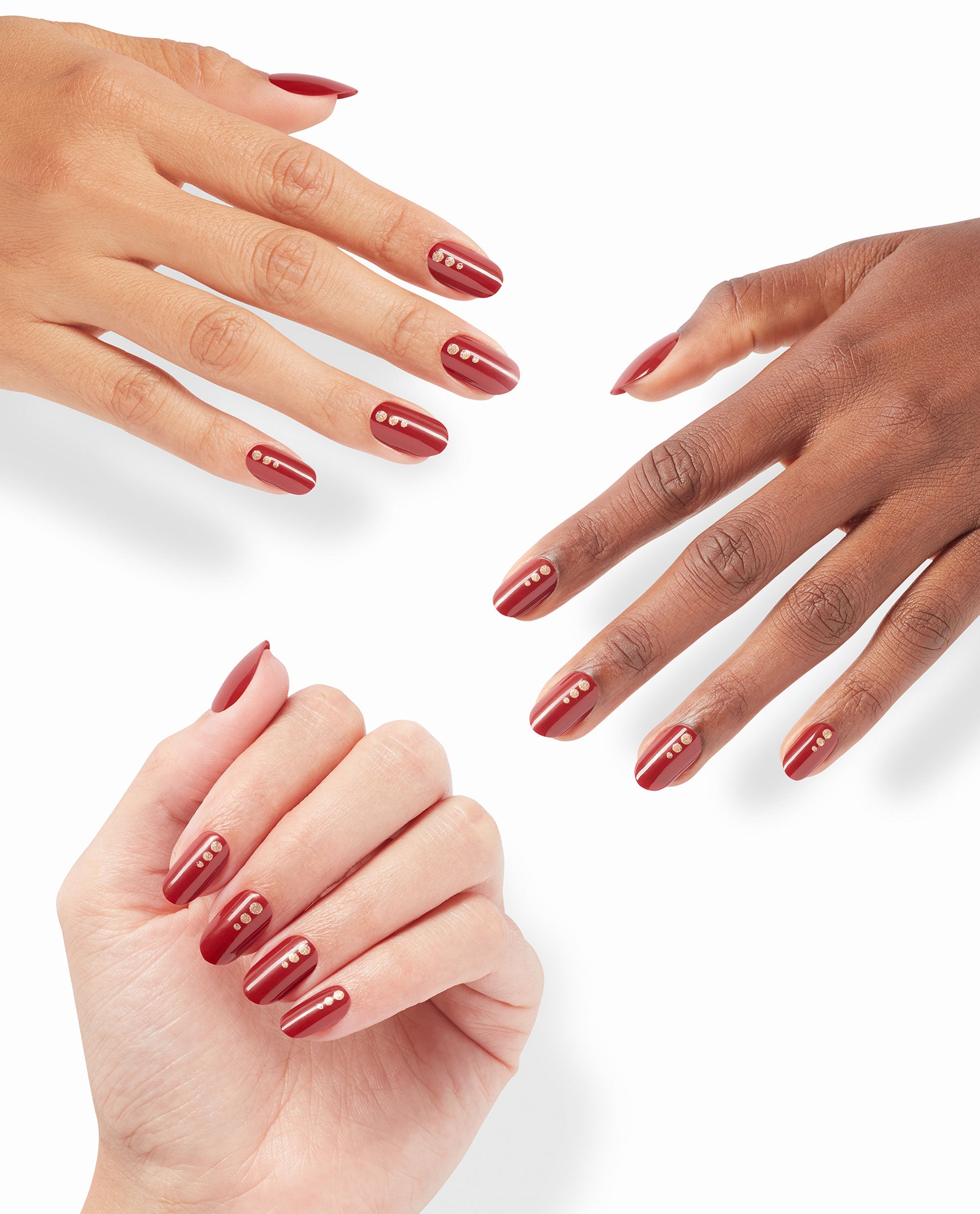 Three hands show OPI On Point Big Candy Apple Red almond nails with glossy deep red polish, slim burgundy stripes, and gold dot accents for a bold fall nail colors look on a white background.