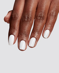 Hand displays glossy white BRB, Doing My Nails at-home gel nail polish on short rounded nails, an OPI trending manicure shade against a light gray studio background.