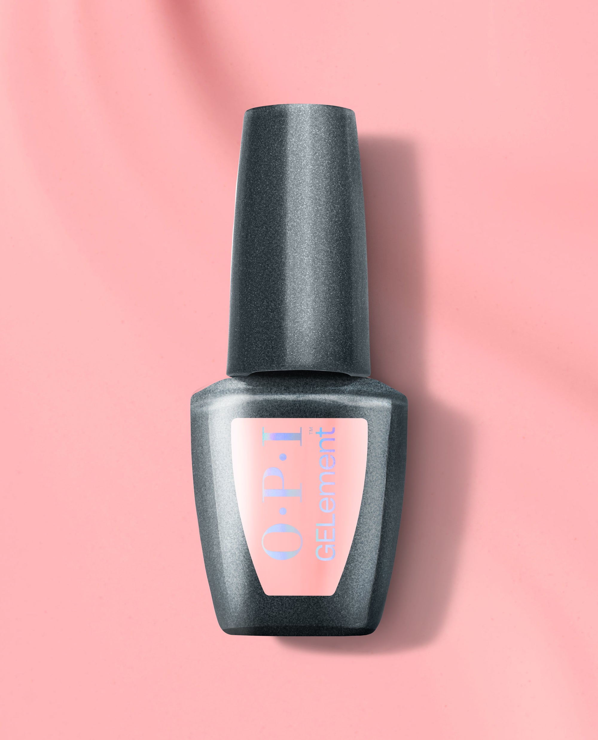 BubbleYUM at-home gel nail polish bottle from OPI GELElement, shown in a sleek charcoal gray container with a soft pink label on a matching pink background, ideal for an OPI nail polish gift set or DIY manicures at home.