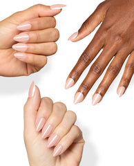 Hands with varied skin tones wear glossy almond-shaped Bubbly Behavior On Point nails in a soft blush pink shade, showcasing OPI fall nail colors on a clean white background.