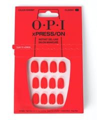 OPI xPRESS/ON Cajun Shrimp press-on nails displayed in bright coral-red packaging, showing glossy short classic artificial nails for a trending instant gel-like salon manicure.