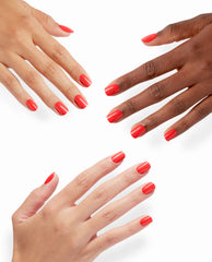 Hands show glossy coral-red OPI Cajun Shrimp xPRESS/ON press-on nails in short rounded shapes against a clean white background.