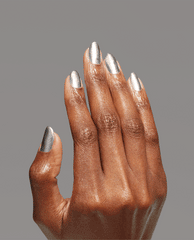 Hand with neatly manicured nails showcases Chrome Clawz OPI nail polish, a high-shine metallic silver nail lacquer, against a smooth gray background, highlighting the reflective chrome finish and full-coverage color on each fingertip.