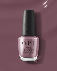 OPI nail polish Claydreaming nail lacquer bottle standing upright, showing its dusty mauve shade and black textured cap against a matching mauve background, highlighting the creamy, full-coverage formula for at-home manicures.