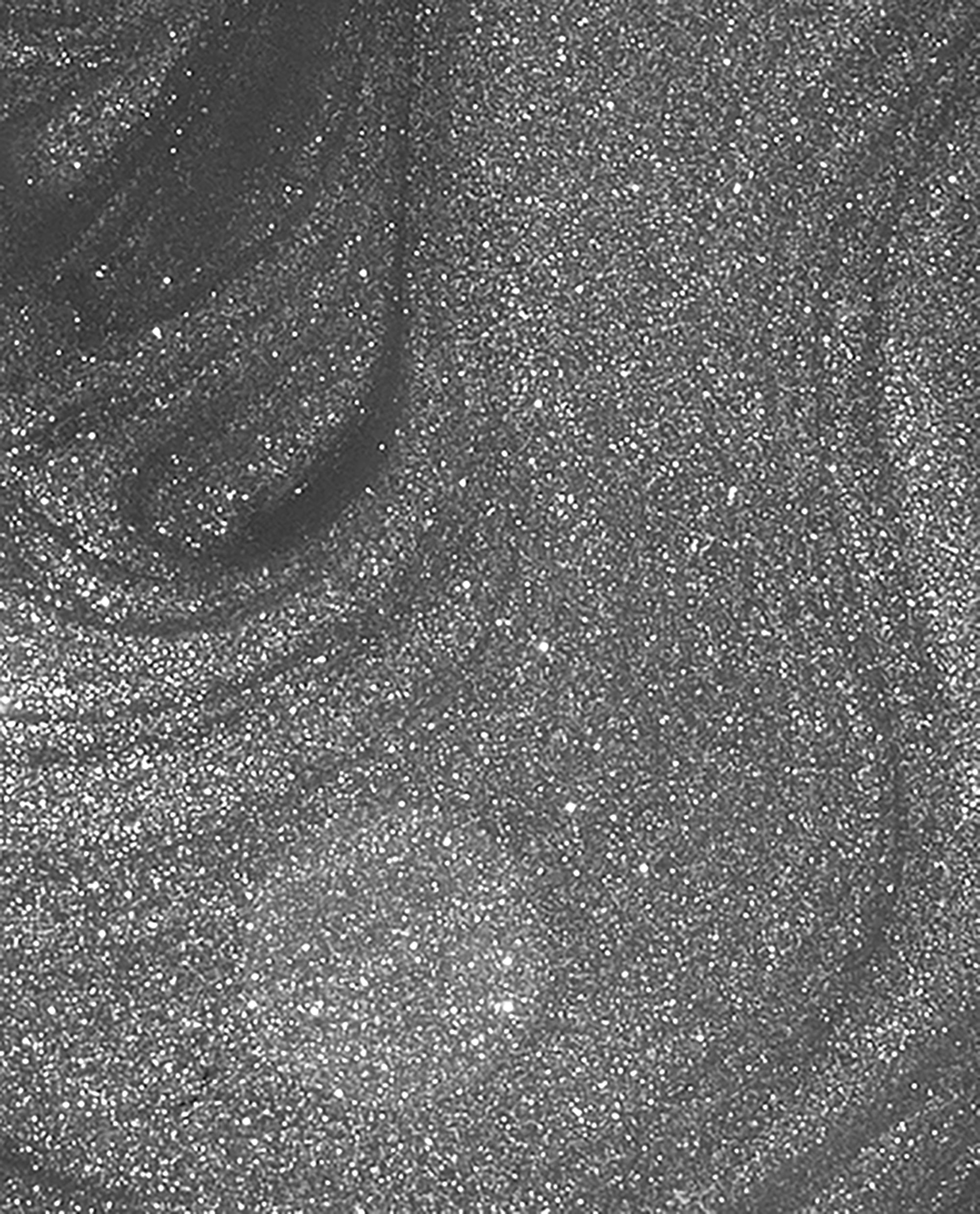 Clean Slate nail lacquer brush swatch showing smooth, medium-gray OPI nail polish packed with fine silver shimmer, swirling across the frame to highlight its metallic, full-coverage finish for manicures and pedicures.