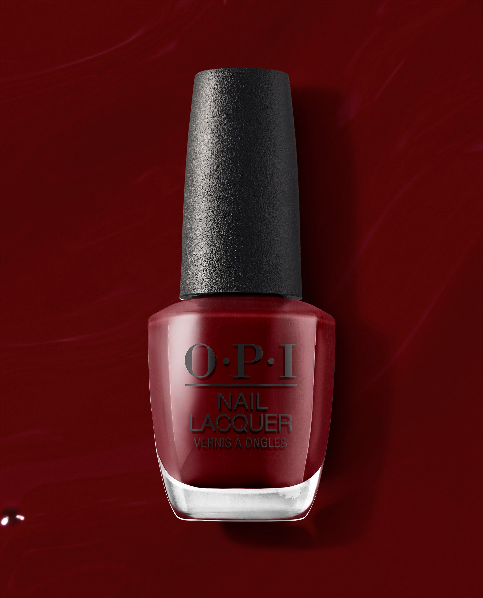OPI nail polish bottle of Como se Llama? nail lacquer standing upright, showing deep wine-red color with glossy finish against a matching dark red background, highlighting the rich, sophisticated shade for manicures and pedicures.