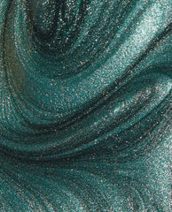 Metallic emerald green nail polish swatch sparkles and swirls in a macro view, showcasing OPI Infinite Shine Cos-mo Money's high-shine shimmer, ideal for spring nail colors; green nail polish by OPI.
