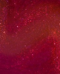 Deer Valley Spice OPI Infinite Shine nail polish swatch showing a deep berry-red shimmer with sparkling pink and copper flecks, a rich choice for fall nail colors.
