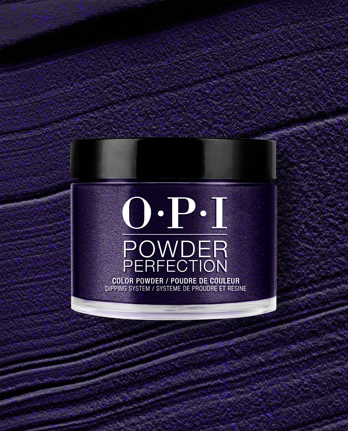 OPI Powder Perfection Don't Over Ink It dipping powder jar displays a deep shimmering purple shade against a textured powder swatch, a bold choice for fall nail colors.