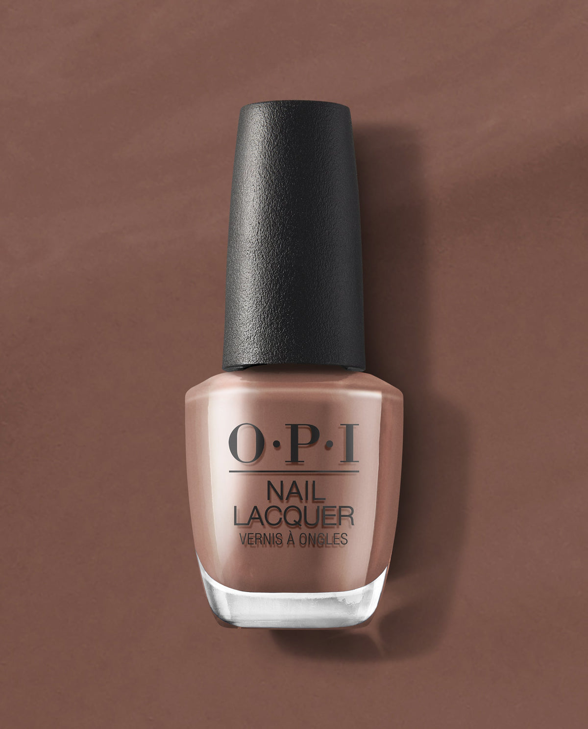 OPI Espresso Your Inner Self nail lacquer bottle in a warm espresso brown shade stands on a matching brown background, ideal for fall nail colors.