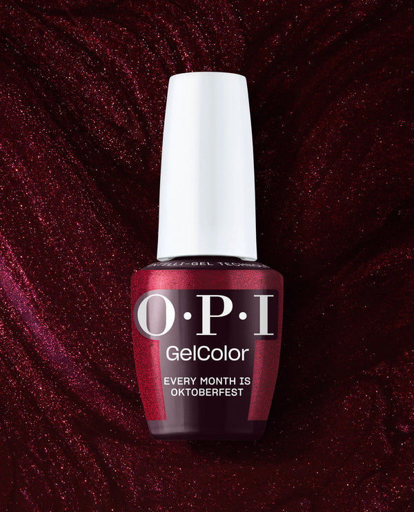 OPI GelColor Every Month is Oktoberfest gel nail polish in deep burgundy shimmer stands upright with a white cap against a sparkling wine-red background, ideal for fall nail colors.
