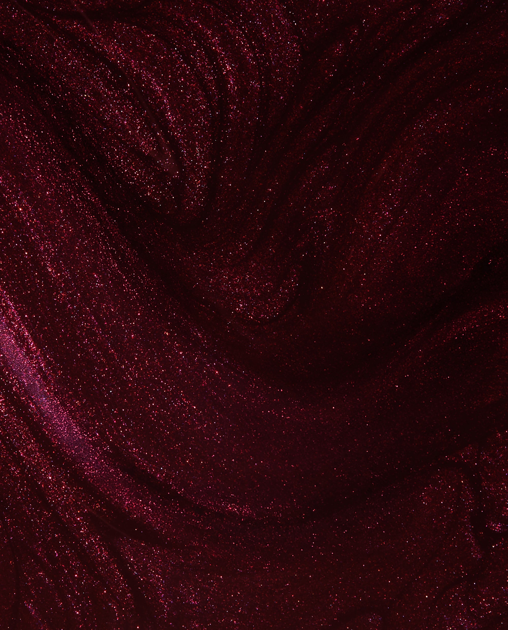 Every Month is Oktoberfest OPI nail lacquer swatch shows a deep burgundy-plum shimmer with fine red sparkle, a rich choice for fall nail colors.