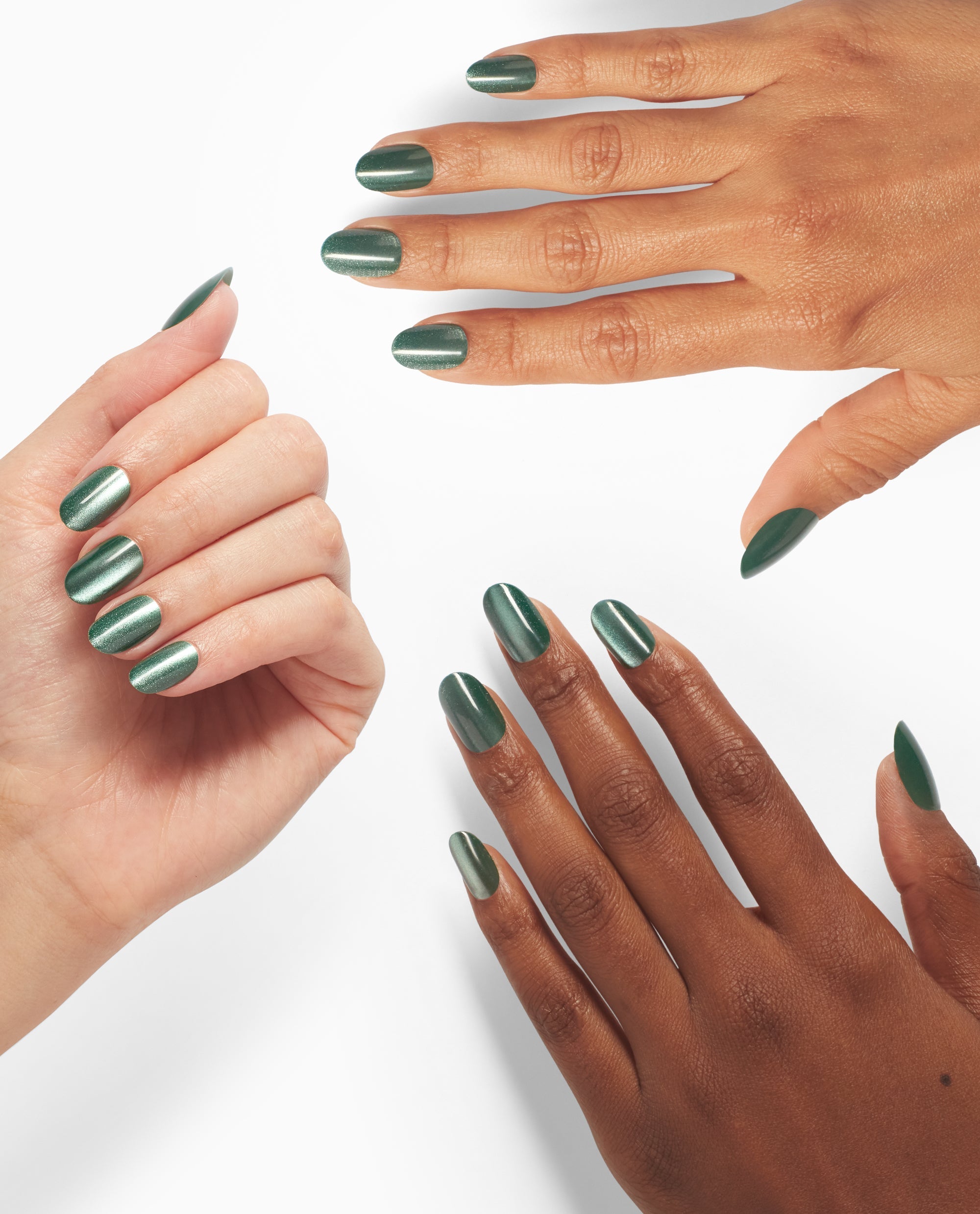 Hands model OPI Feelin’ Capricorn-y xPRESS/ON press-on nails in metallic forest green shimmer, shown in rounded and almond shapes on a clean white background.