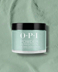 OPI Powder Perfection Feelin’ Capricorn-y dipping powder jar showcases a pastel mint green nail polish shade with fine shimmer, set on a matching powder surface with subtle confetti specks—fresh pick for spring nail colors from OPI.