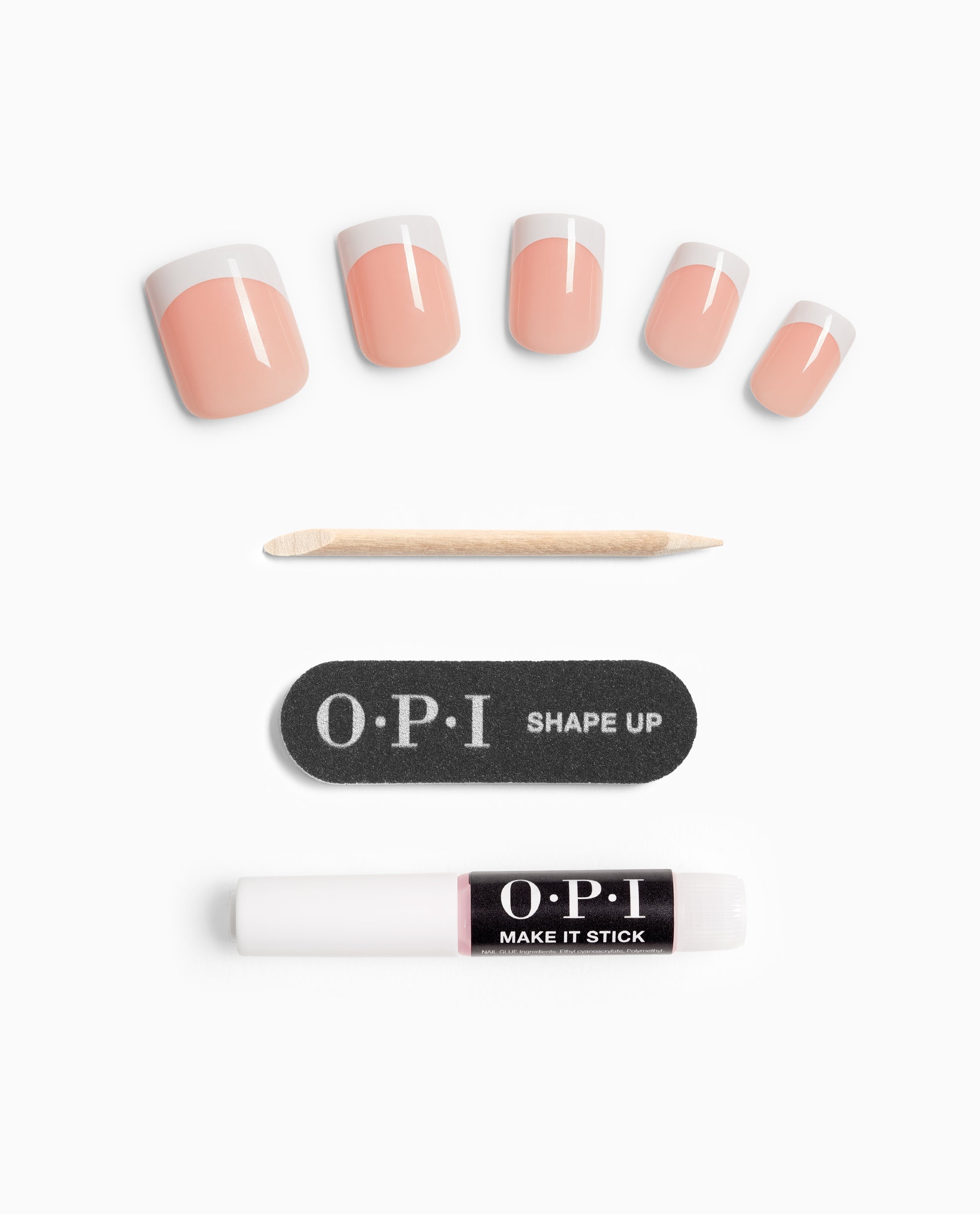 Fluent in French On Point OPI nail polish gift set featuring five peach and white French tip press-on nails, a wooden cuticle stick, a black OPI Shape Up mini nail file, and an OPI Make It Stick adhesive pen on a white background.