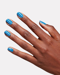Hand modeling glossy sky blue nails painted with OPI Fresh as a Blue Daisy Nature Strong Vegan Nail Lacquer against a clean white background.