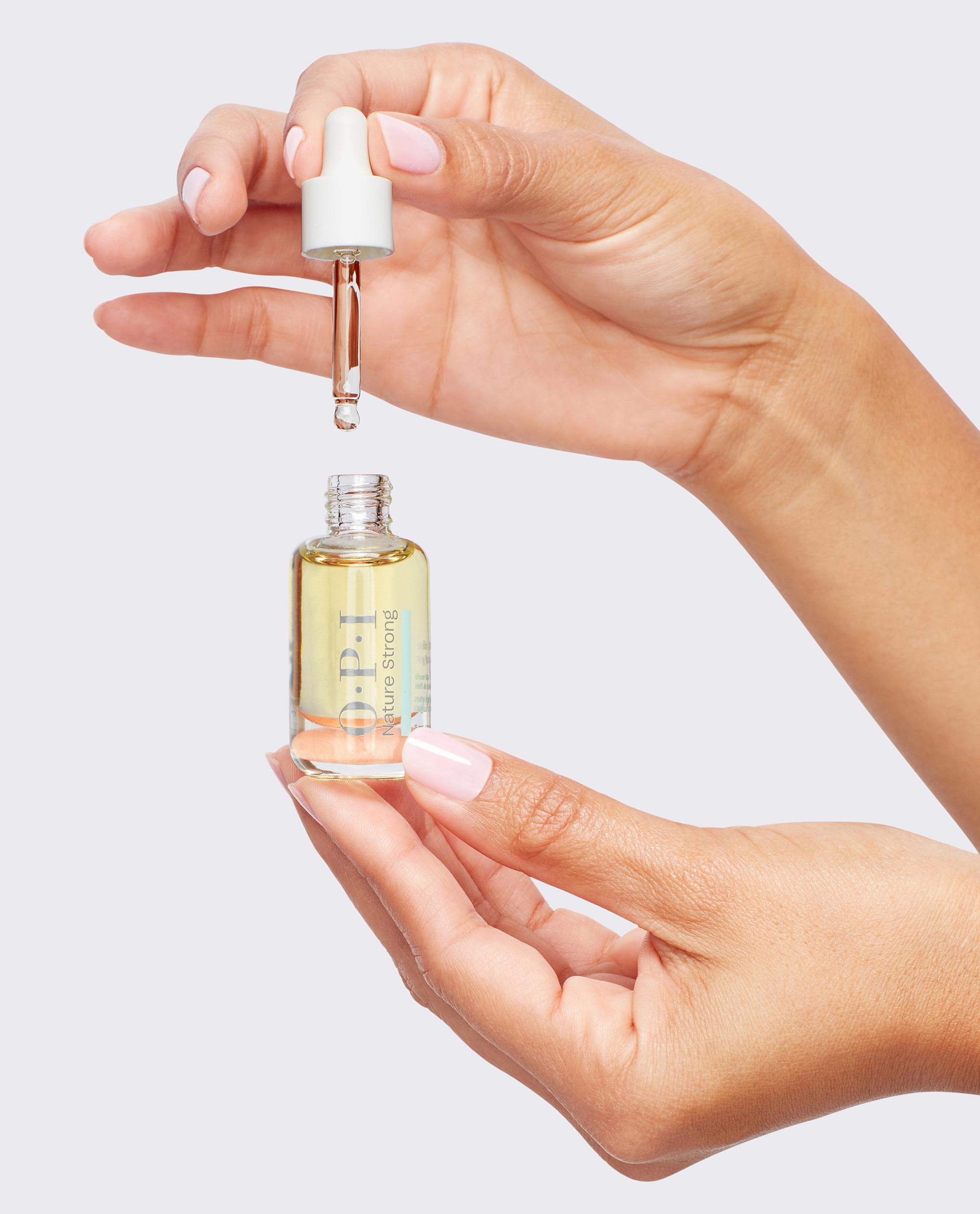 Glow Up Nail & Cuticle Oil Hand and Bottle