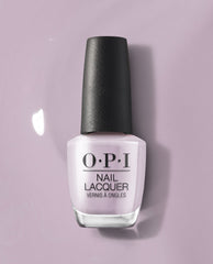 OPI nail polish bottle in the Graffiti Sweetie shade standing upright, showcasing pale lavender nail lacquer with a black cap against a matching soft purple background, highlighting the glossy pastel color for manicures and pedicures.