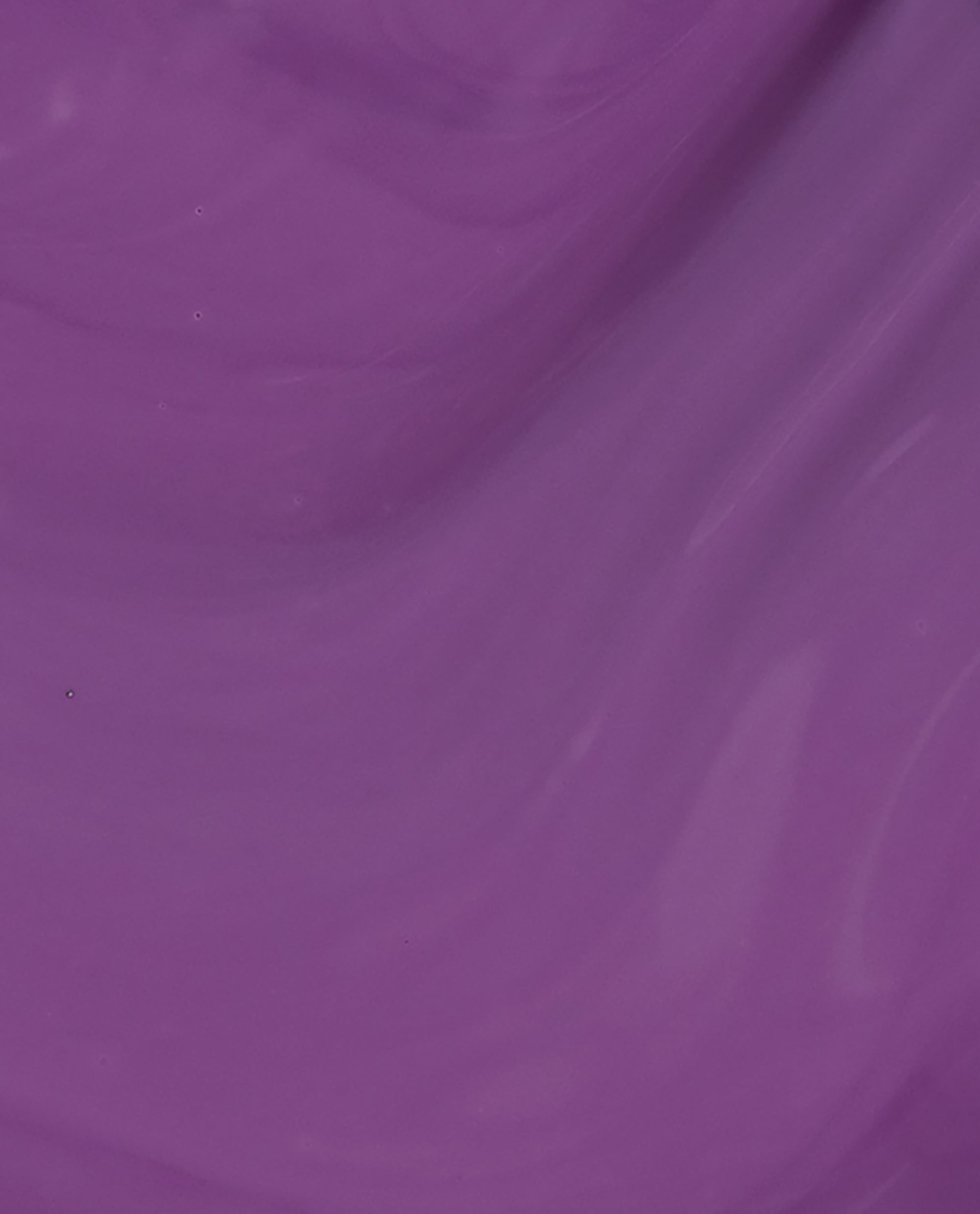 Grandma Kissed a Gaucho OPI nail polish flows in a smooth, glossy swatch of rich medium purple nail lacquer, showing its creamy, opaque finish and subtle tonal variations across the surface.