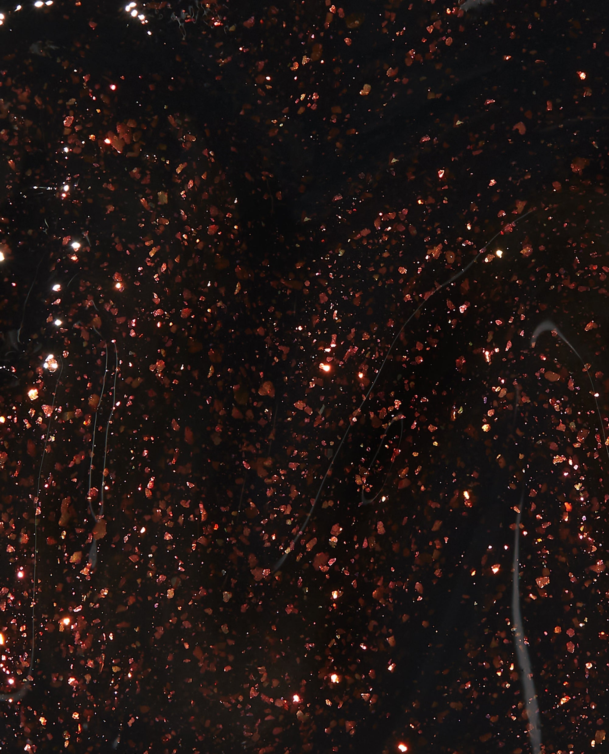 Grunge Queen nail lacquer swatch showing deep black OPI nail polish base packed with dense copper and burgundy glitter flecks, creating a dark grunge, high-shine finish against a glossy liquid backdrop.