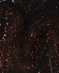 Grunge Queen nail lacquer swatch showing deep black OPI nail polish base packed with dense copper and burgundy glitter flecks, creating a dark grunge, high-shine finish against a glossy liquid backdrop.