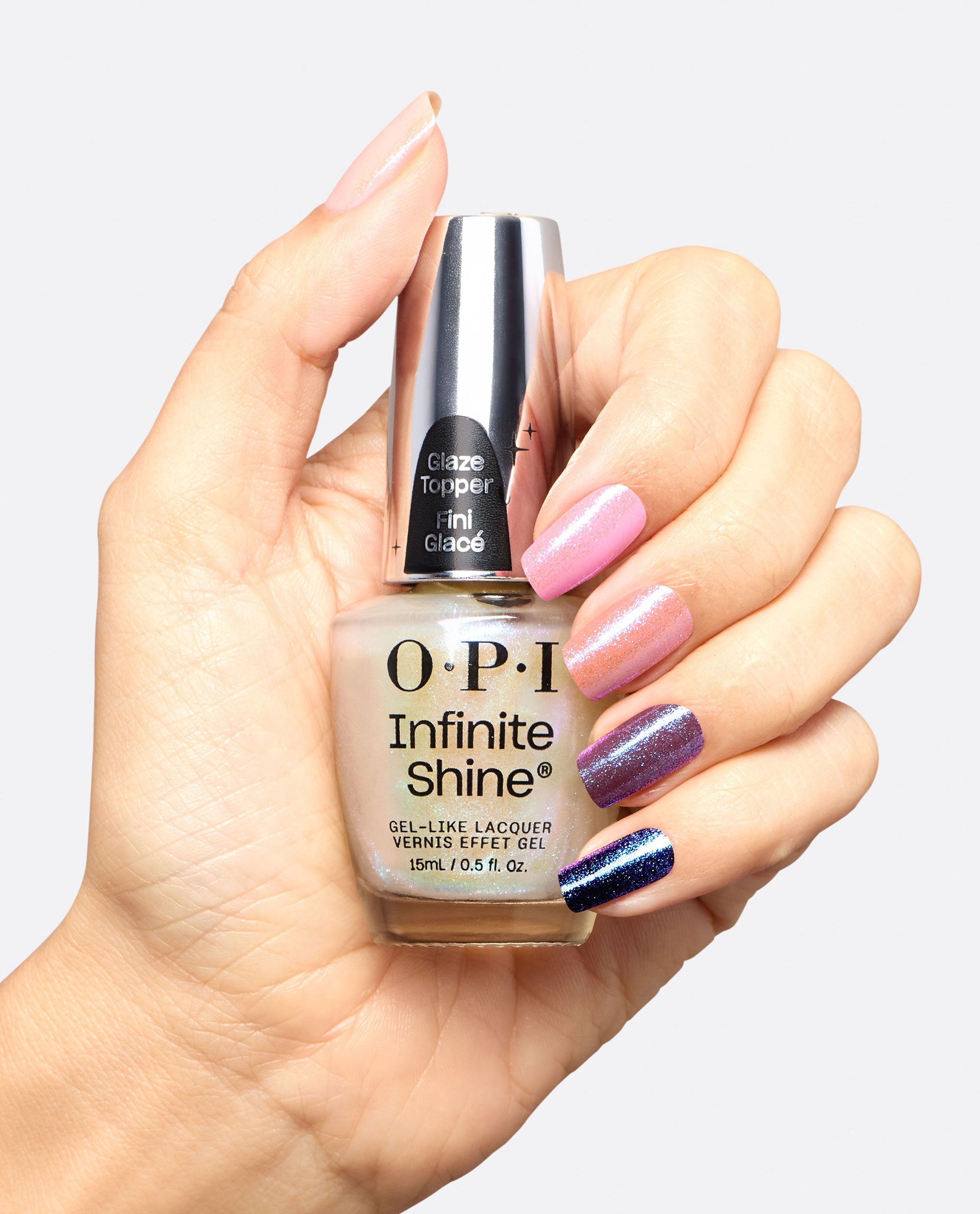 Holo and Behold Iridescent Blue‑Purple Glaze Nail Polish Topper Hand and Bottle