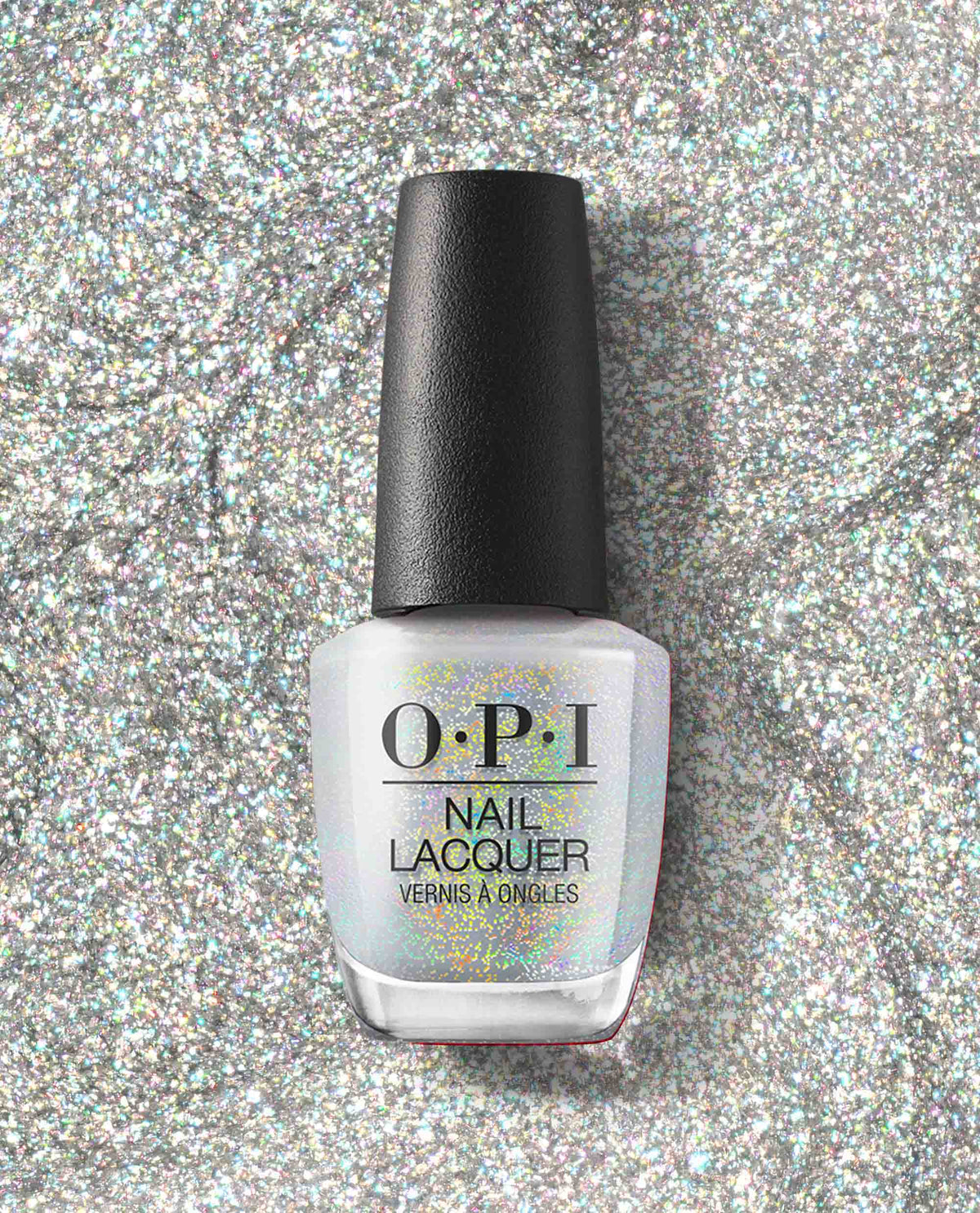 OPI nail polish bottle of I Cancer-tainly Shine nail lacquer standing upright on a sparkling silver glitter background, showcasing its iridescent white shimmer finish for manicures and pedicures.