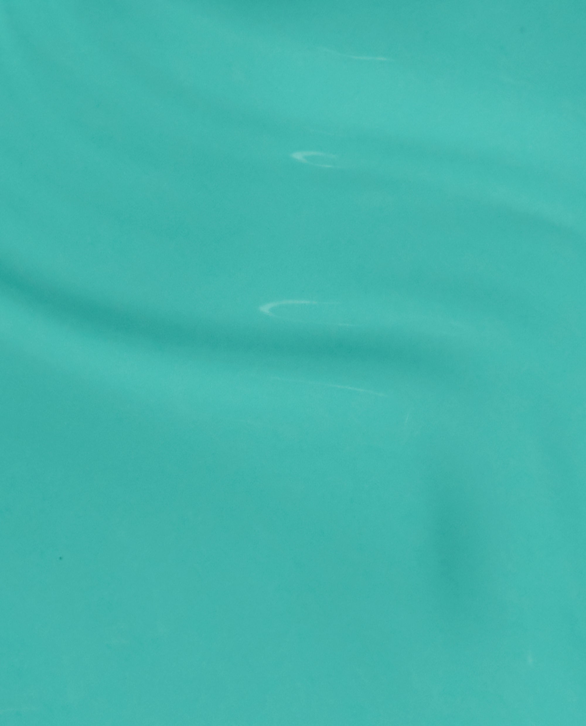 OPI I’m Yacht Leaving gel nail polish brush swatch spreading smoothly with subtle ripples, a glossy teal-green finish that highlights vibrant green nail polish and trending spring nail colors for US shoppers.