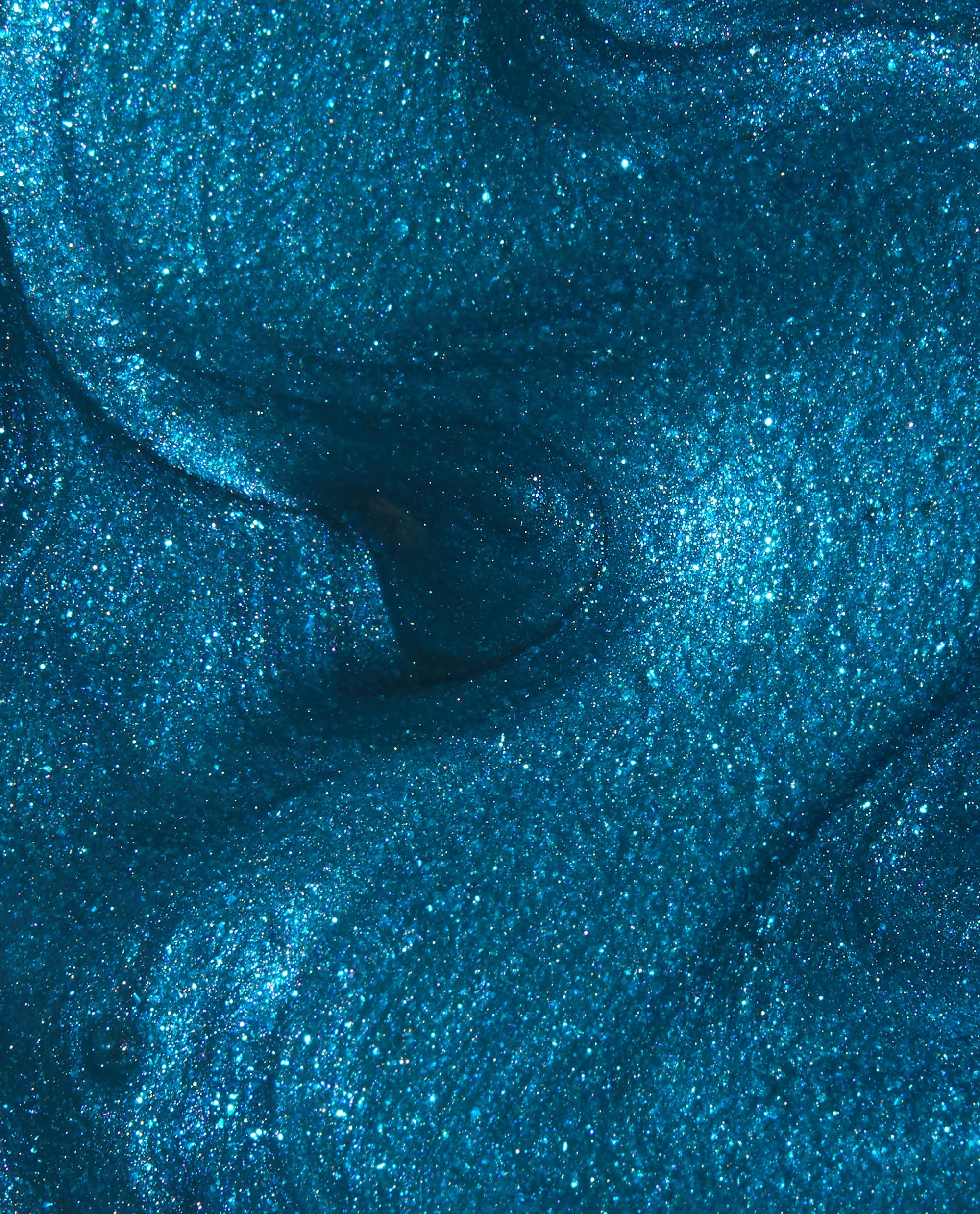 I Sea You at-home gel nail polish swatch shimmers in trending OPI-inspired teal blue with fine glitter and a glossy, ocean-like metallic finish in a close-up texture view.