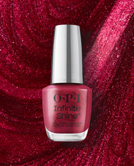 OPI Infinite Shine I'm Not Really a Waitress gel-like lacquer bottle showcases a shimmery deep red-pink shade against a sparkling crimson polish background, a bold choice for fall nail colors.