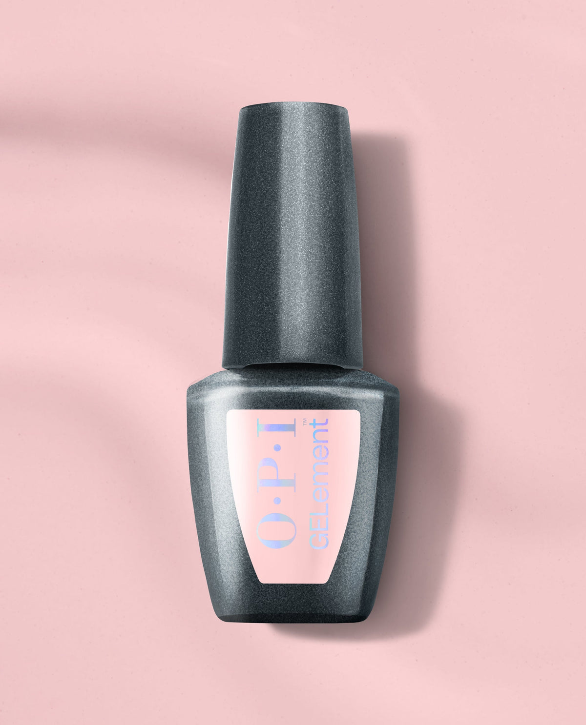 OPI I’m the Gloss! at-home gel nail polish bottle in shimmering charcoal gray stands upright on a soft pink background, showcasing a trending salon-style gel manicure shade.