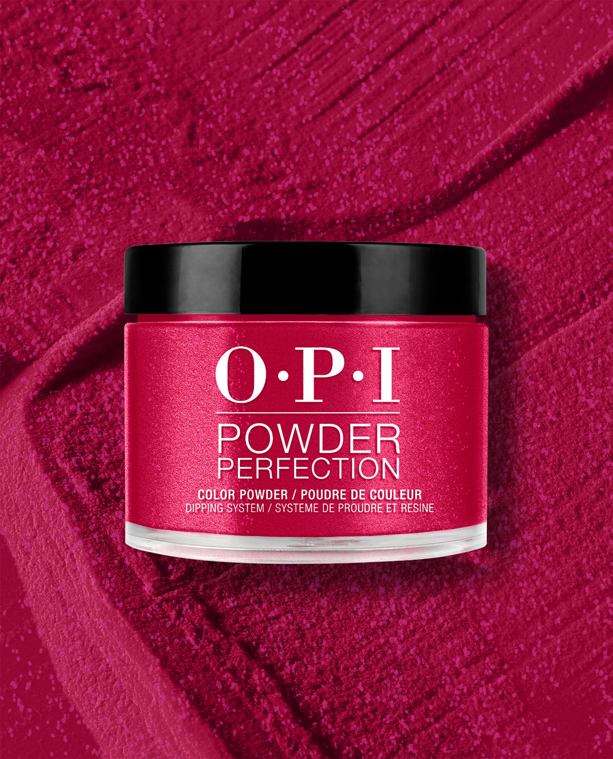 OPI It’s All Greek to Me dipping powder jar with black lid in a rich shimmery magenta shade, displayed on a matching textured powder background for bold fall nail colors.