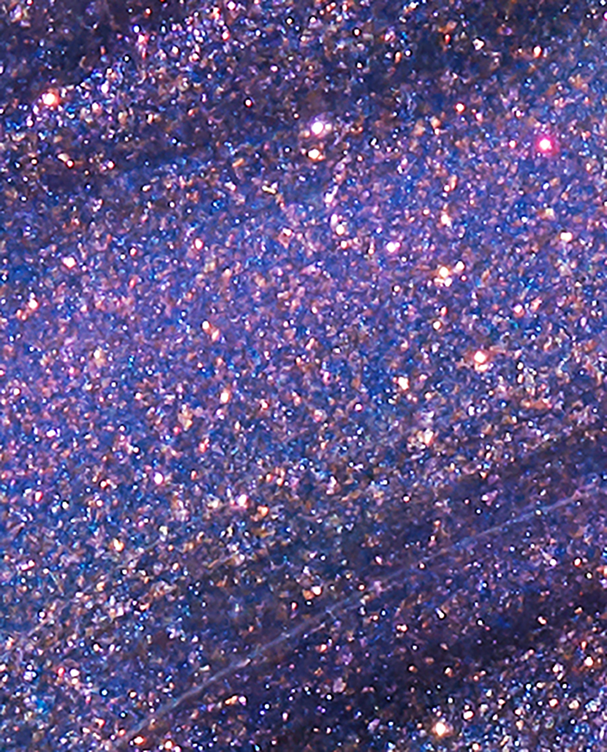 Leonardo’s Model Color nail lacquer displaying a close-up of dense purple-blue glitter with pink and gold sparkle, showcasing the shimmery finish and texture similar to OPI nail polish for bold, glamorous manicures.