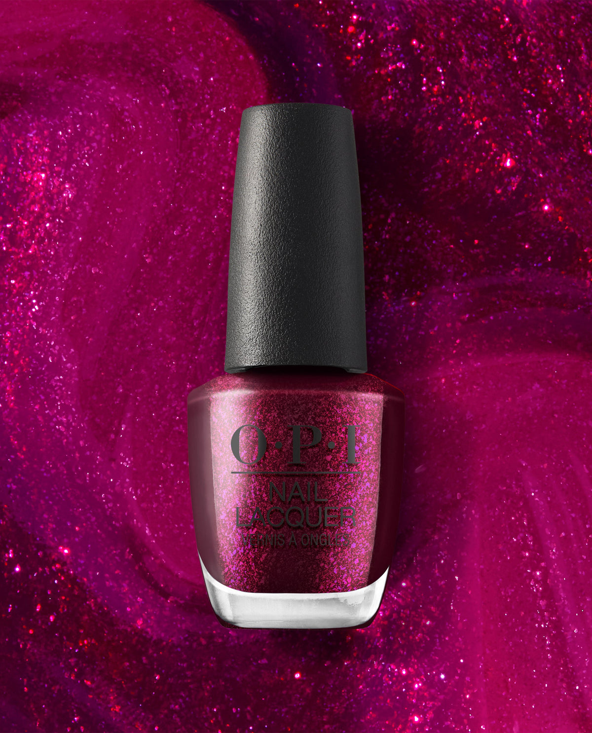 OPI Lincoln Park After Brunch nail lacquer bottle with a black cap and deep magenta shimmer polish, centered against a sparkling pink glitter background.